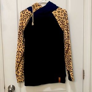Ampersand doublehood cheetah print sleeves.